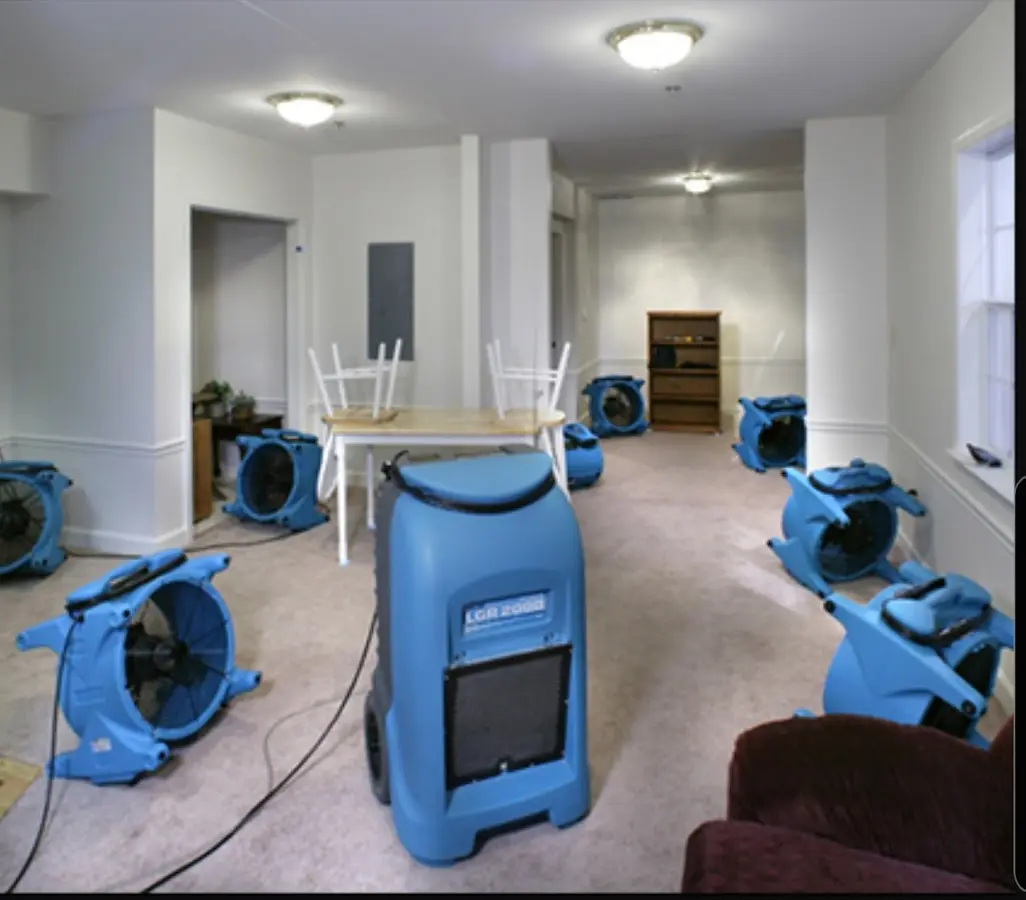 Air movers and dehumidifier setup for Water Damage Restoration in Darby